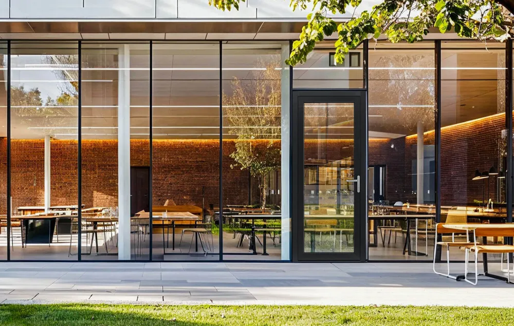 Aluminum commercial curtain wall with swing door