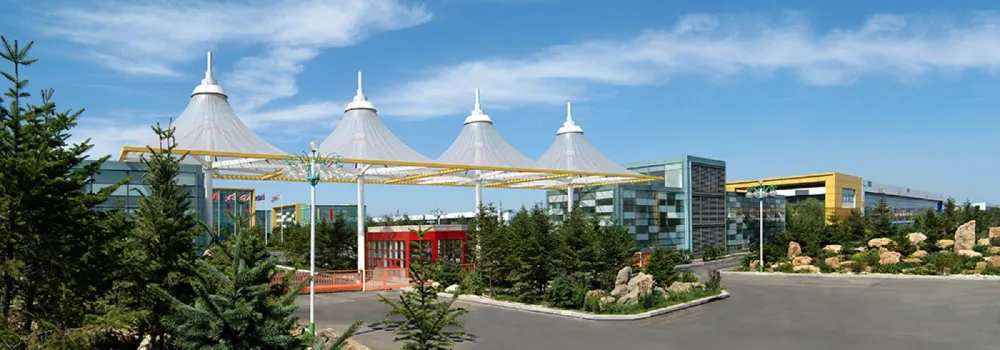 Factory campus entrance gate with tension-membrane canopy structures and production buildings